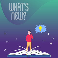 Writing note showing What S New Question. Business concept for when you ask someone about his current live events actions Man Standing Behind Open Book Jagged Speech Bubble with Bulb