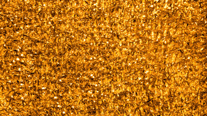 Gold tinsel texture.Yellow Golden tinsel background.