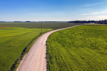 Gravel road in countryside landscape.