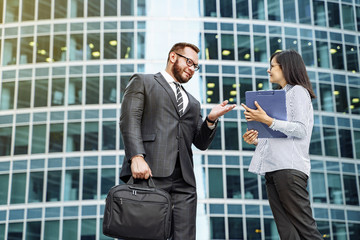 Modern business. Business team brainstorming. Successful business man and young woman communicating