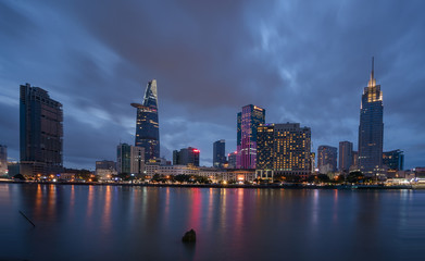 The best of night view in Ho Chi Minh City, Vietnam. Colorful of city light beside the Saigon river with skyline at sunset. Royalty high quality free stock image.