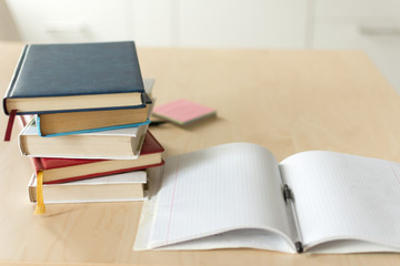 Stack of books on wooden table. Heap fo books on wooden background. Education concept.