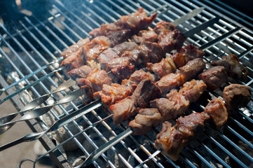 Grilled shashlik in the smoke. Cooking process