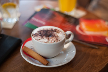a cup of coffee on the table in a small restaurant