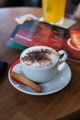 a cup of coffee on the table in a small restaurant