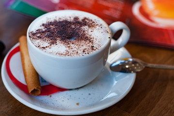 a cup of coffee on the table in a small restaurant