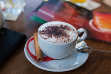 a cup of coffee on the table in a small restaurant