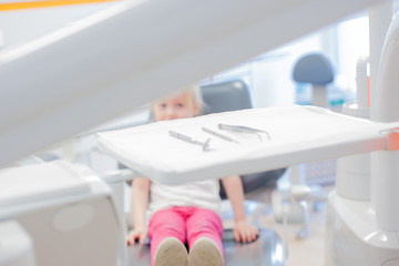 little girl in the dental chair. control at the dentist.