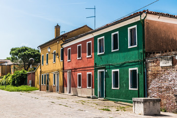 Fototapeta na wymiar Bright houses on a small street