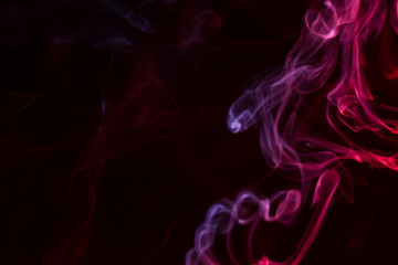 Colorful smoke close-up on a black background