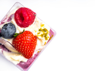 Yogurt desert with raspberries, blackberry, strawberry and nuts