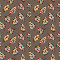 Seamless Pattern of Colored Leaves on Brown Background.