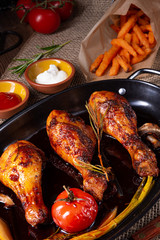 grilled chicken legs in barbecue marinade with sweet potatoes