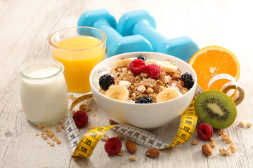 healthy breakfast with muesli, fruit and meter concept