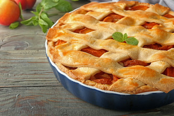 Tasty peach pie on table, closeup