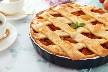 Tasty peach pie on table, closeup