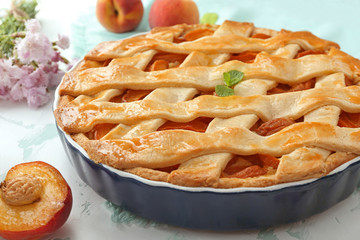 Tasty peach pie on table, closeup