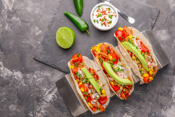 Composition with tasty tacos on grunge background