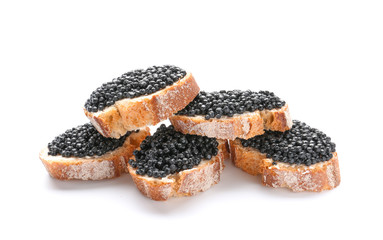 Sandwiches with black caviar on white background