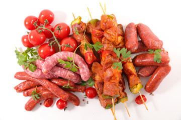assorted raw meats for barbecue isolated on white background