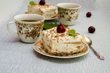 Tiramisu, a traditional Italian dessert in a light background. Close-up