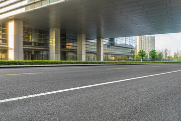 empty asphalt road front of modern buildings.