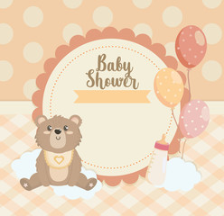 label of teddy bear with balloons and feeding bottle