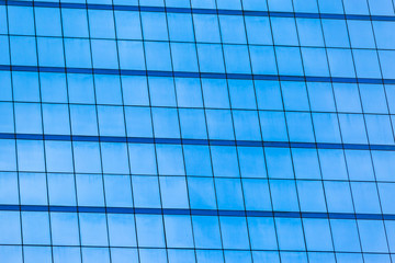Obraz premium Blue glass windows of office building