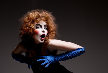 Woman mime with theatrical makeup. Studio shot.