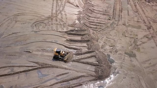 Beach Dredging Aerial shot. Beach Reclamation drone footage. Construction Equipment And Pipes on a Beach. Buldozers and Excavator. Spring 2019. Gdansk, Poland.