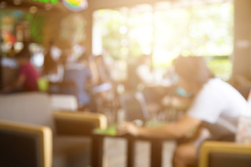 Blur image of customers at coffee cafe or restaurant