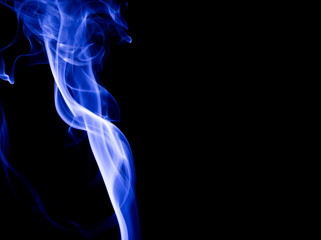 Blue smoke on black background