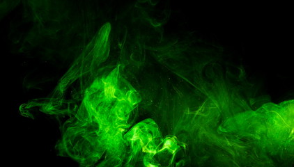 Green smoke on black background