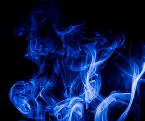 Blue smoke on black background