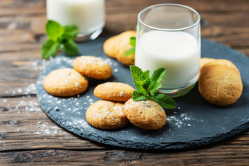 Homemeade cookies with milk on the wooden table