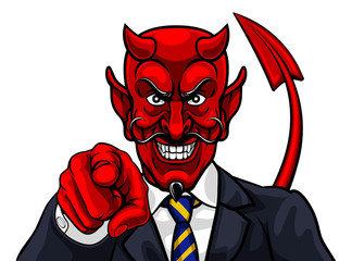 An evil devil or Satan businessman in business suit pointing at the viewer