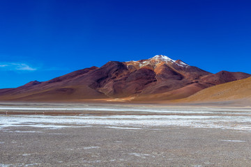 Colored Red Altiplanic Lagoon, a shallow saline lake in the southwest of the Altiplano of Bolivia