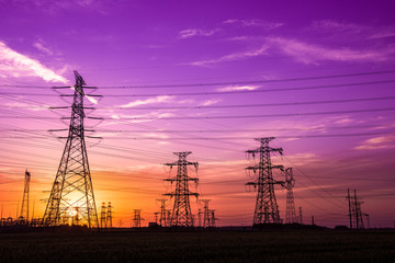 Fototapeta premium Silhouette of Power Supply Facilities at Sunset