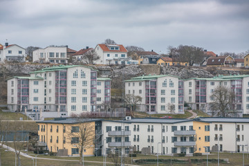 Fototapeta na wymiar Picture of colored suburban apartment building. Scandinavian style