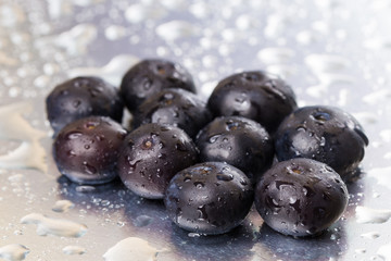 Ripe blueberries on a white background with water drops. Macro. Close-up.