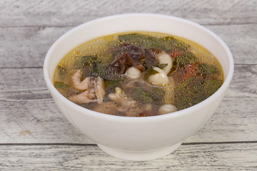 Thai style soup with meat and mushrooms