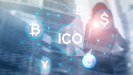 ICO - Initial coin offering, Blockchain and cryptocurrency concept on blurred business building background.