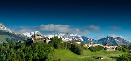 panorama view the historic castle and village of Gruyeres with mountain landscape