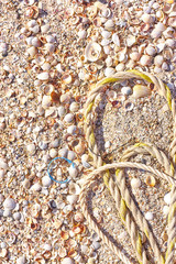 A tangled mess of fishing nets plastic rope and other debris washed up on a coastal beach. Save the Planet stock picture.