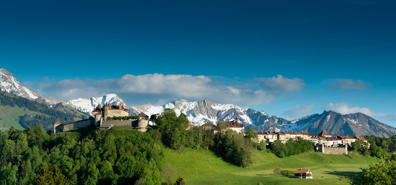 panorama view the historic castle and village of Gruyeres with mountain landscape