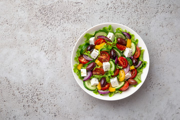 greek salad ( tomato, cucumber, bel pepper, olives  and feta cheese) in white bow