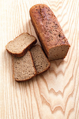 Sliced rye bread on cutting board Top view closeup