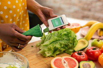 Small nitrate meter in hands of a beautiful woman.