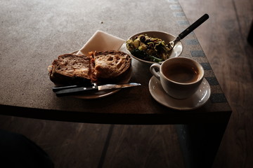 cup of coffee and cake on table