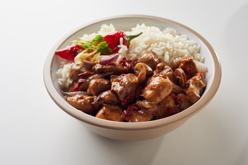 Individual bowl of rice over white background